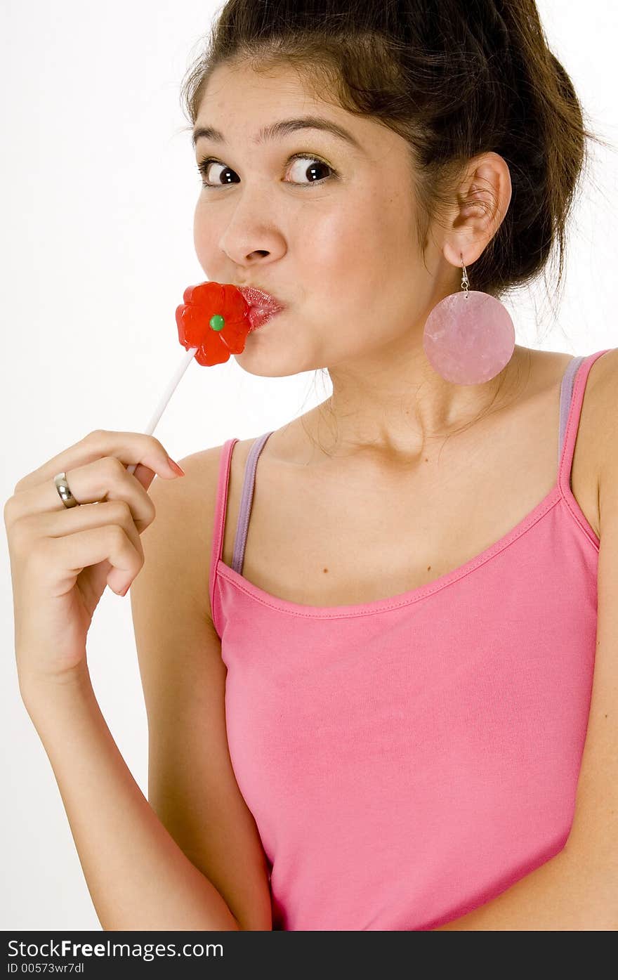 A cute asian girl with a flower lolly. A cute asian girl with a flower lolly