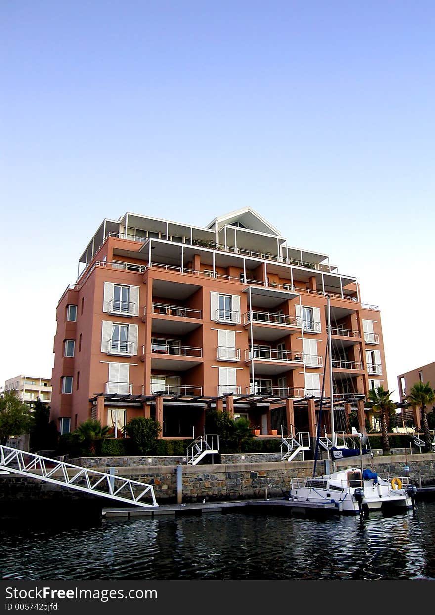 Portrait photo of luxury residential unit from canal. Portrait photo of luxury residential unit from canal.