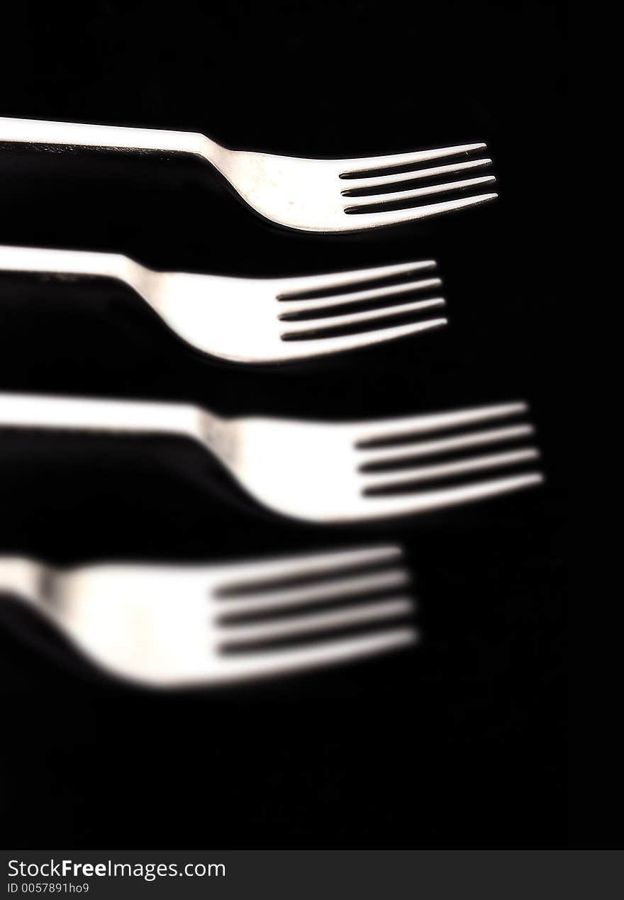 Forks on black