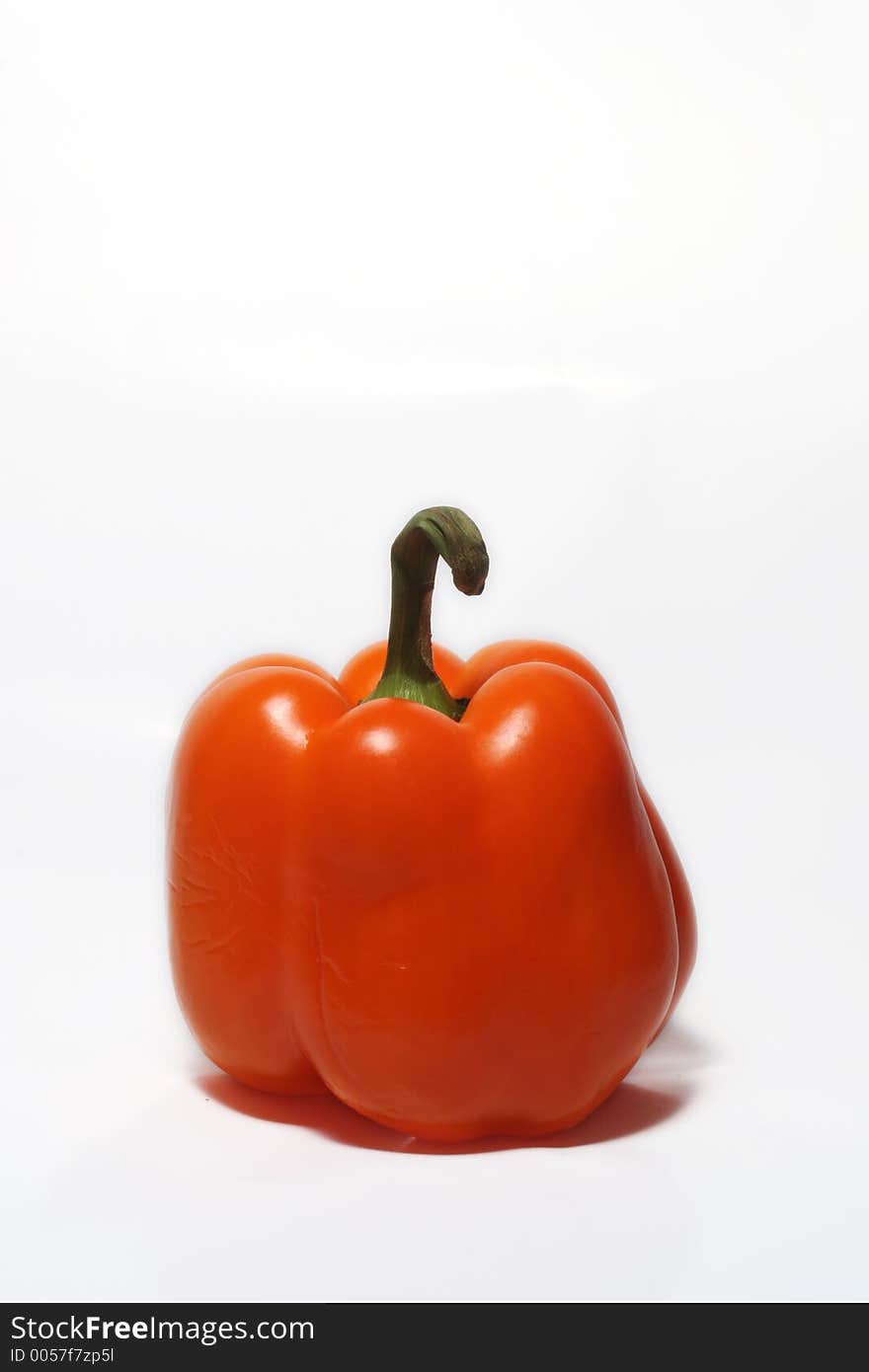 Orange bell pepper on white, room for text