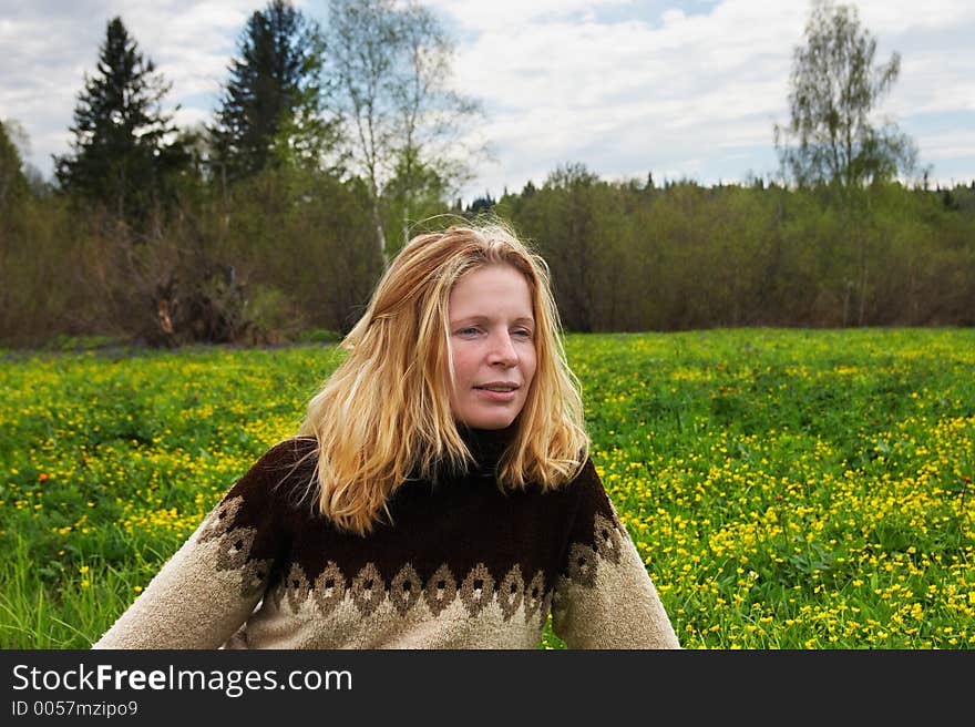 Woman on green field. Sibir.