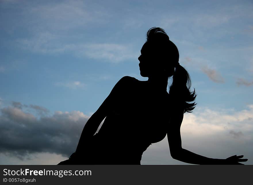 Silhouette Of A Woman And The Sky