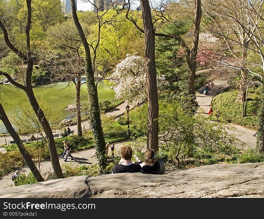 Some people resting on the rocks in Central Park in Manhattan. Some people resting on the rocks in Central Park in Manhattan.