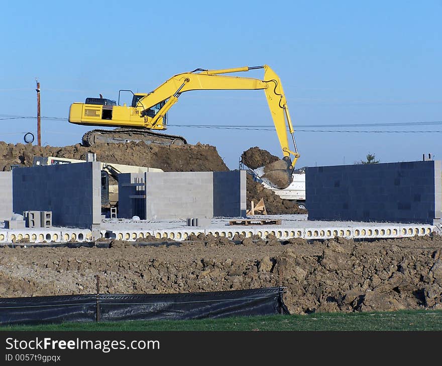 Large backhoe at work site