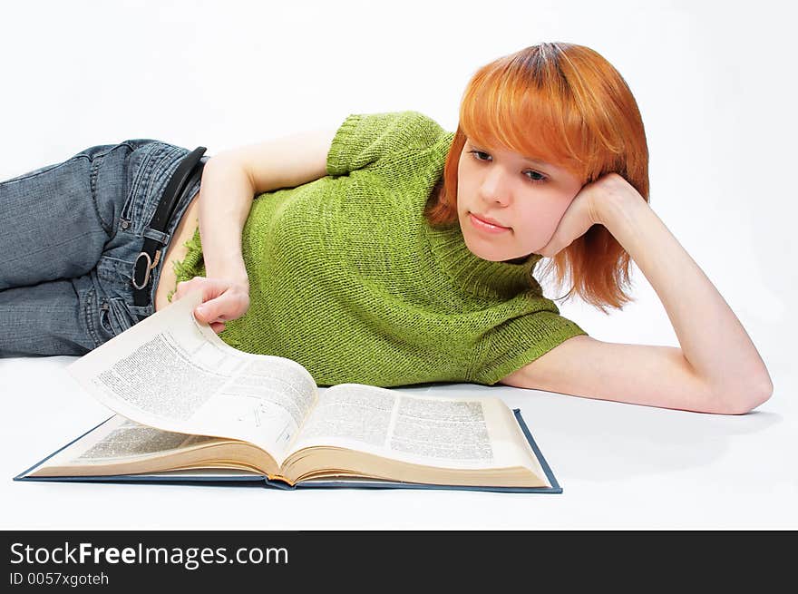 Young girl read the book on white