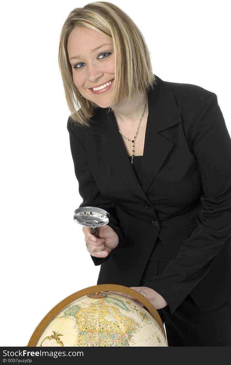 Beautiful blonde in business suit with magnifying glass and globe. Beautiful blonde in business suit with magnifying glass and globe.