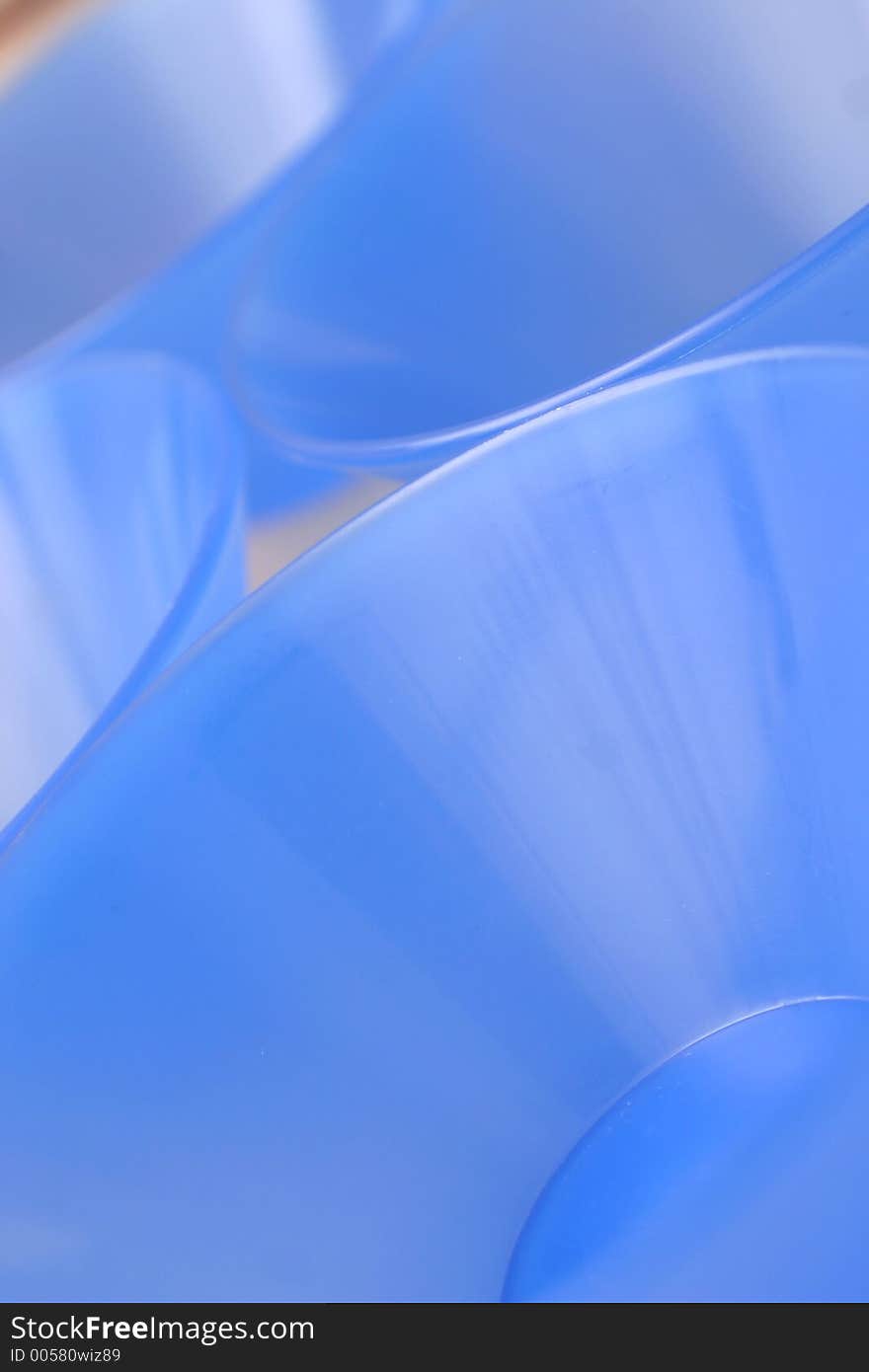 Blue conical plastic bowls laid out. Blue conical plastic bowls laid out