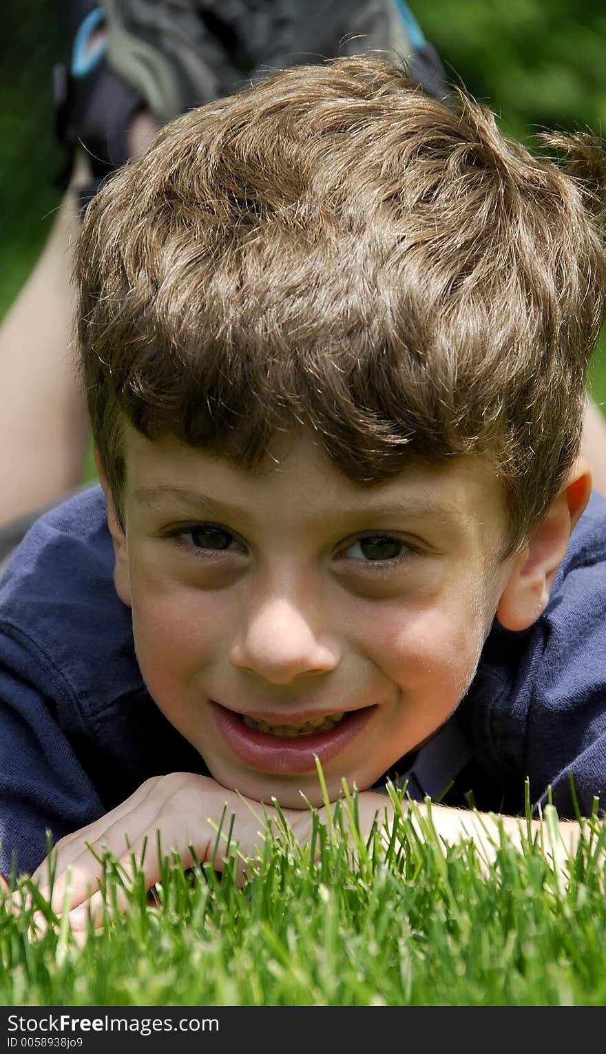 Child Laying on a Lawn. Child Laying on a Lawn