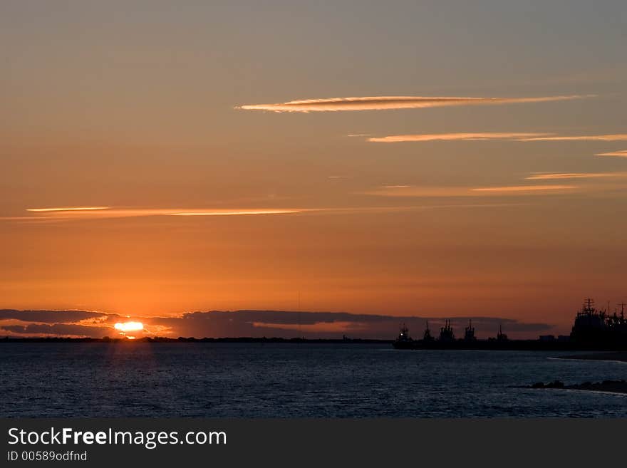 Mediterranean dock at sunset with ships