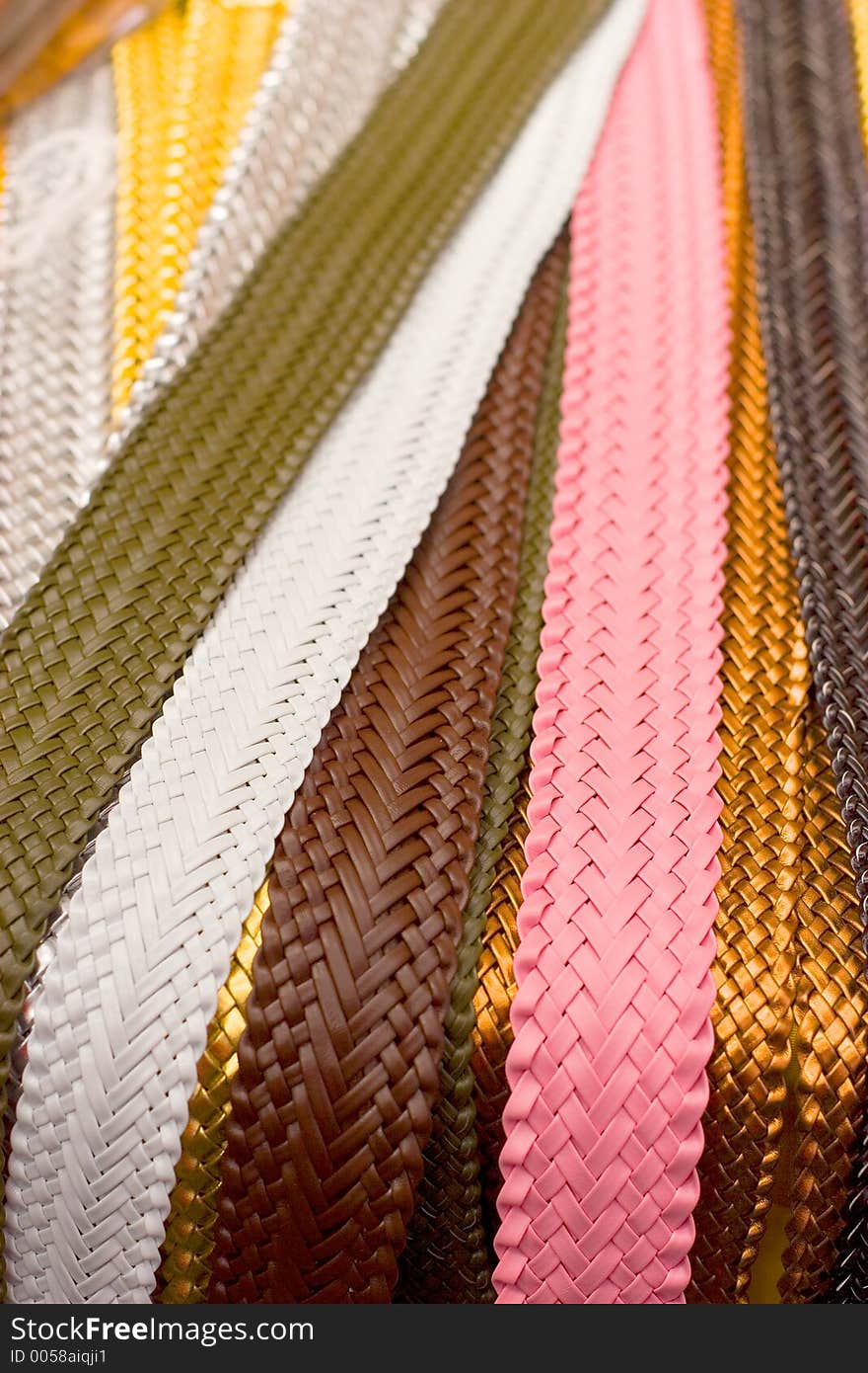 Lots of belts in a street market