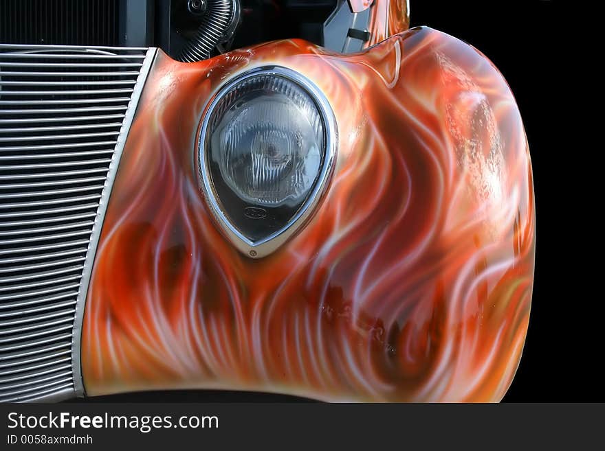 Headlight and grille of a classic hot rod. Headlight and grille of a classic hot rod