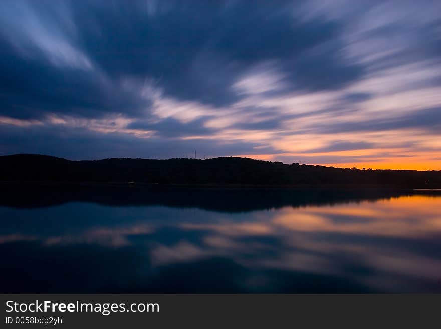 Clouds moving in a scenic lake  landscape. Clouds moving in a scenic lake  landscape