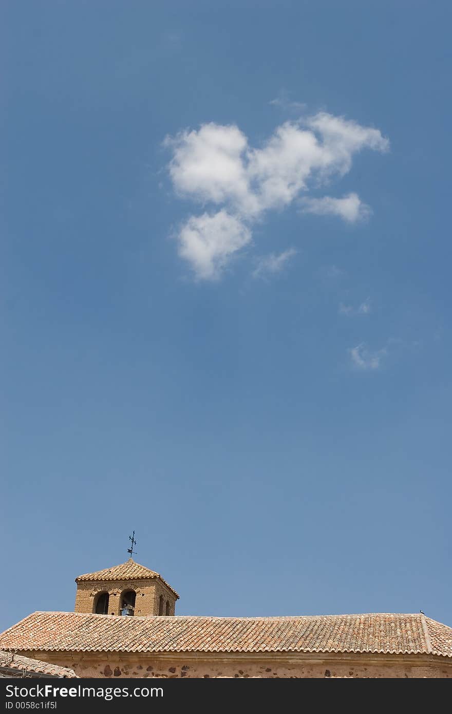 Spanish roman church with clouds in the sky