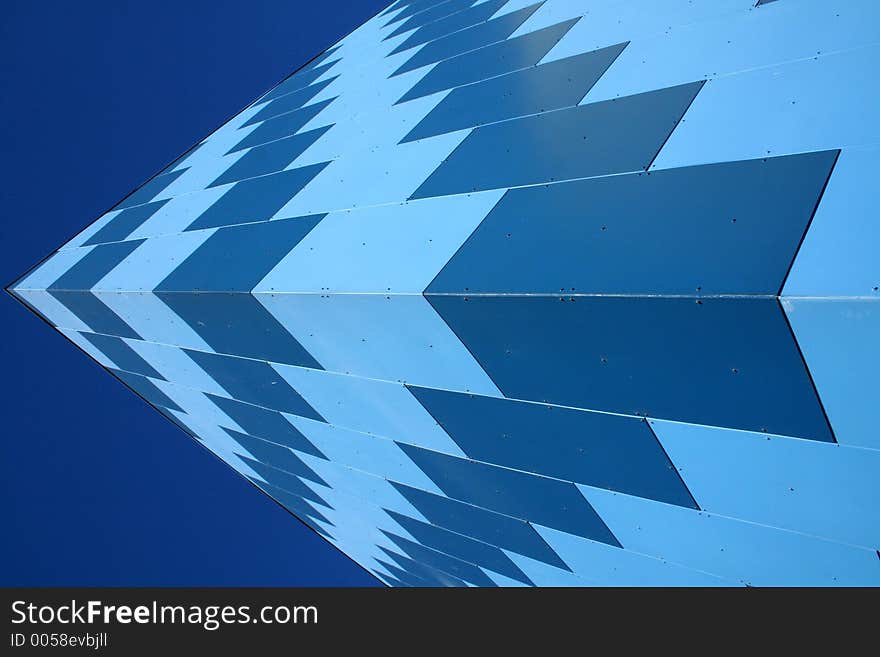 Corner of a blue panelled building. Corner of a blue panelled building