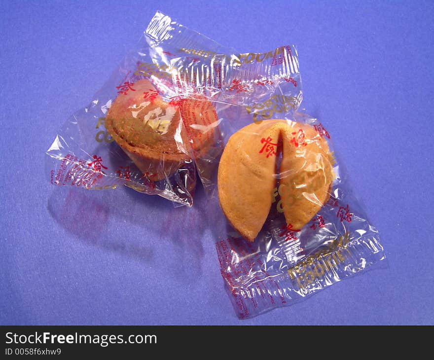 Two fortune cookies in their original packages. Two fortune cookies in their original packages