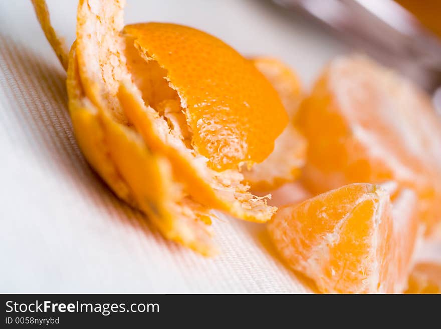 Tangerine pieces with skin on side. Tangerine pieces with skin on side