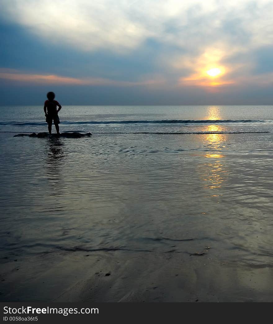 Boy playing at the beach