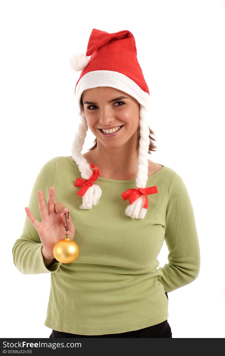 Portrait of a young woman holding gold Christmas ornament. Portrait of a young woman holding gold Christmas ornament