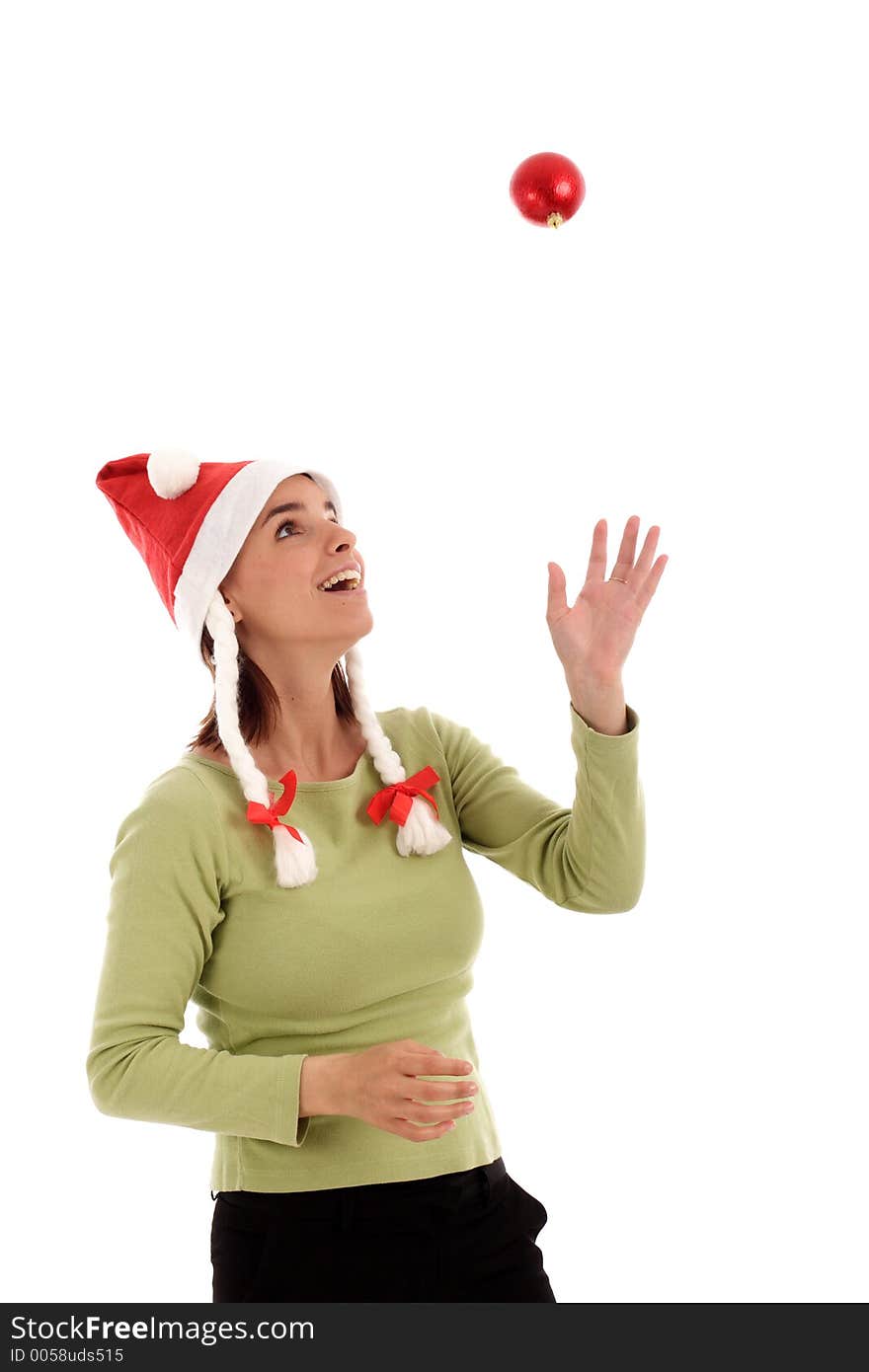 Young woman playing with Christmast tree ornament. Young woman playing with Christmast tree ornament