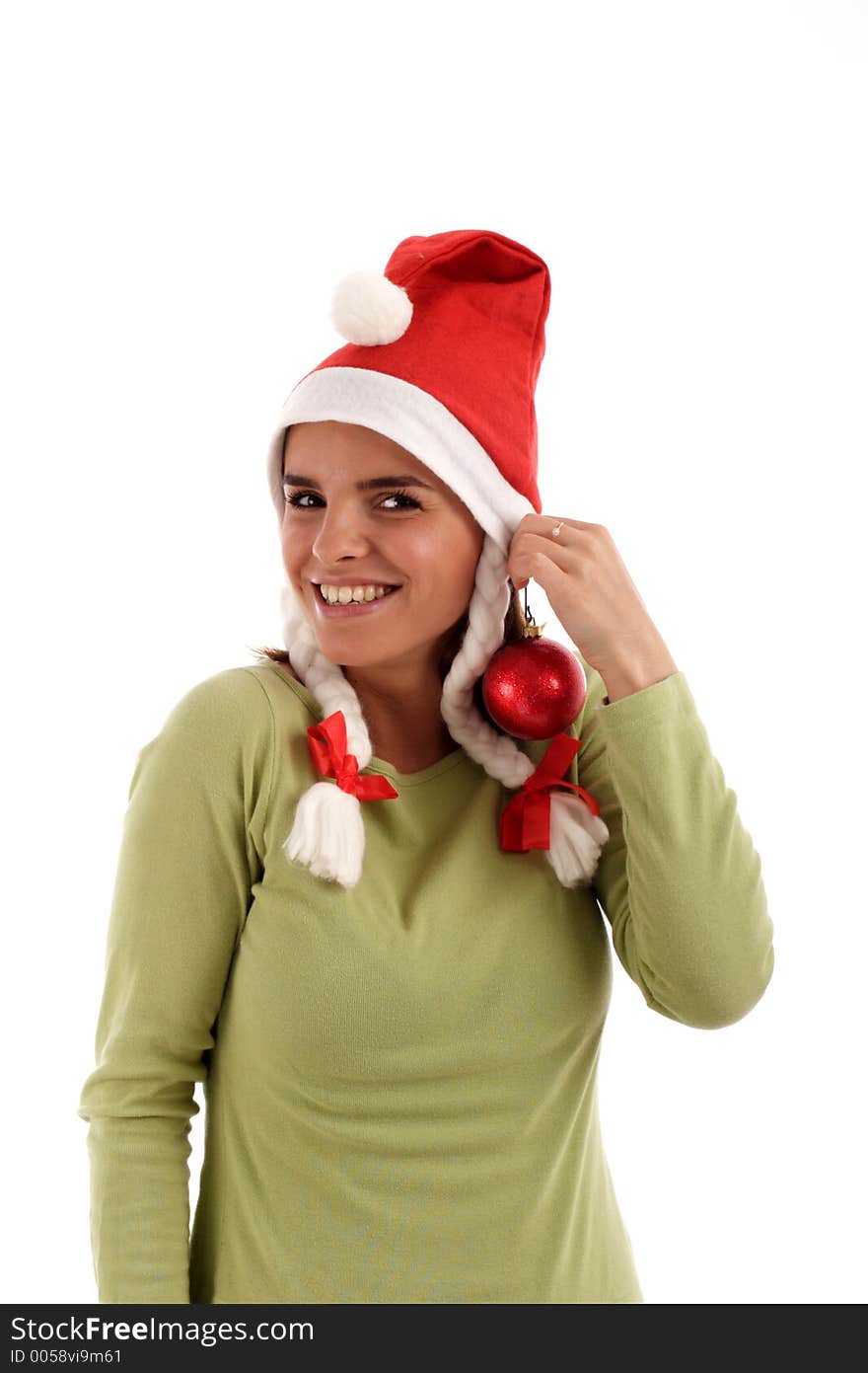 Portrait of a young pretty woman wearing Santa hat, holding red bauble. Portrait of a young pretty woman wearing Santa hat, holding red bauble