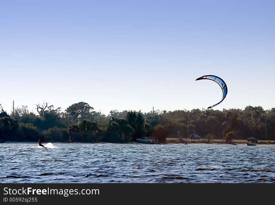 Windsurfer catching some wind. Windsurfer catching some wind