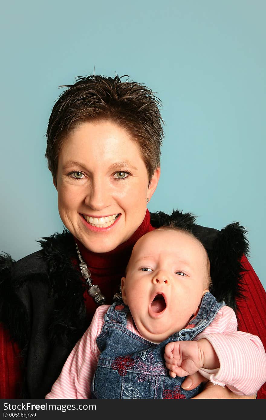 Young mother with baby in studio