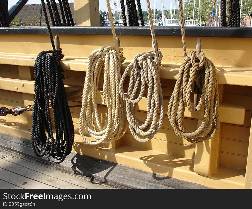 Different color ropes attached to sea ship. Different color ropes attached to sea ship