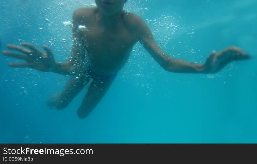 Young boy underwater. Young boy underwater