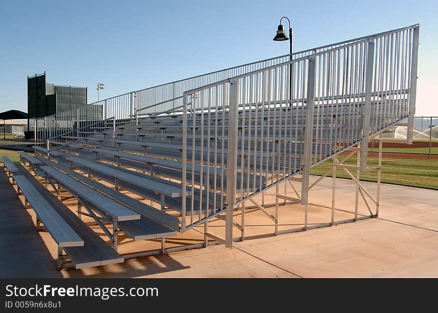 Image of metal fan bleachers at a municipal ball park.