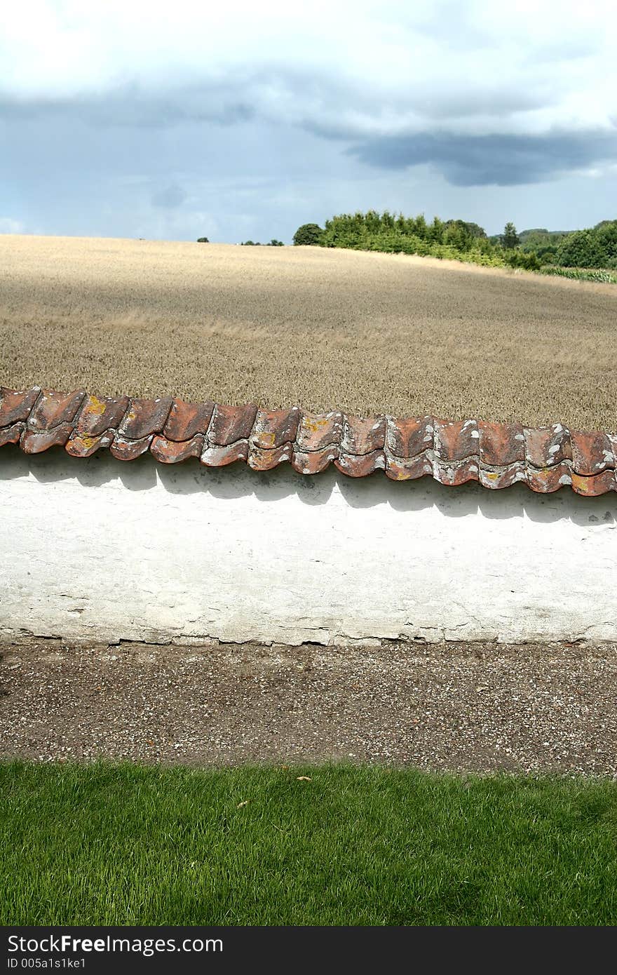 In the country nearby a danish village in the summer a wall in the sun. In the country nearby a danish village in the summer a wall in the sun