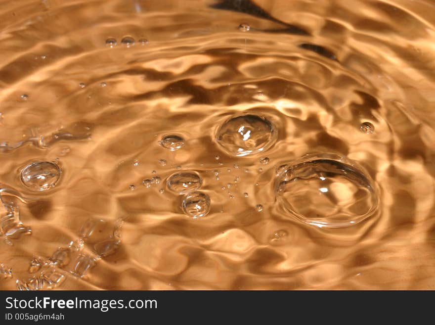 Bubbles in colored water on a brown background. Bubbles in colored water on a brown background