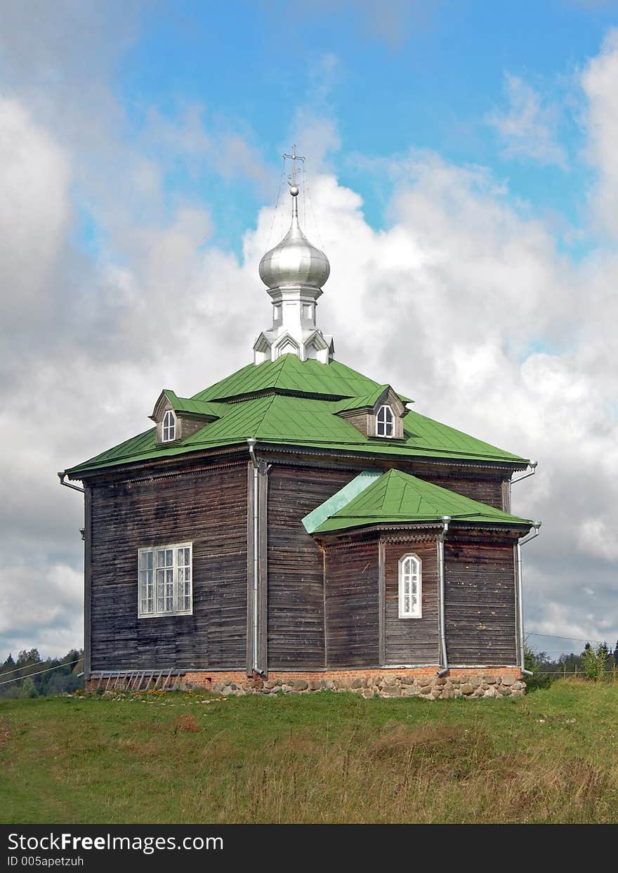 Wooden church in Volgoverkhovie. Wooden church in Volgoverkhovie