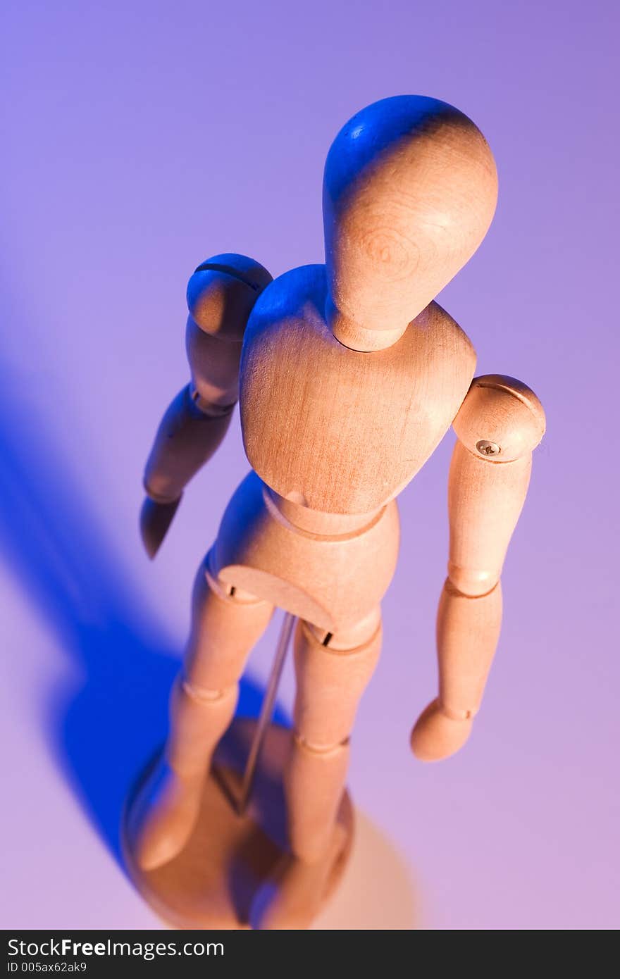 Artist's mannequin with blue and orange lighting