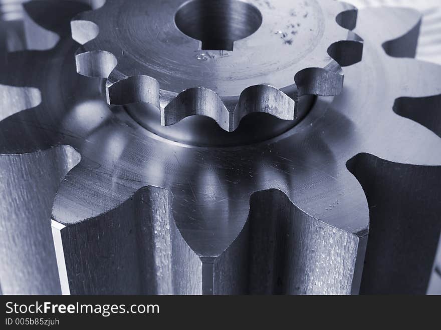 Close-up of two cogs, gears in blue color. Close-up of two cogs, gears in blue color