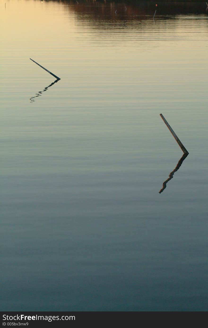 Pair Of Winter Mooring Sticks In Twilight