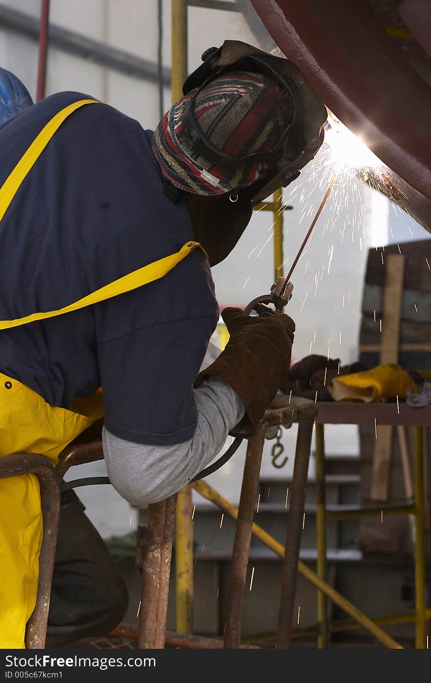 Back view of welder working. Back view of welder working