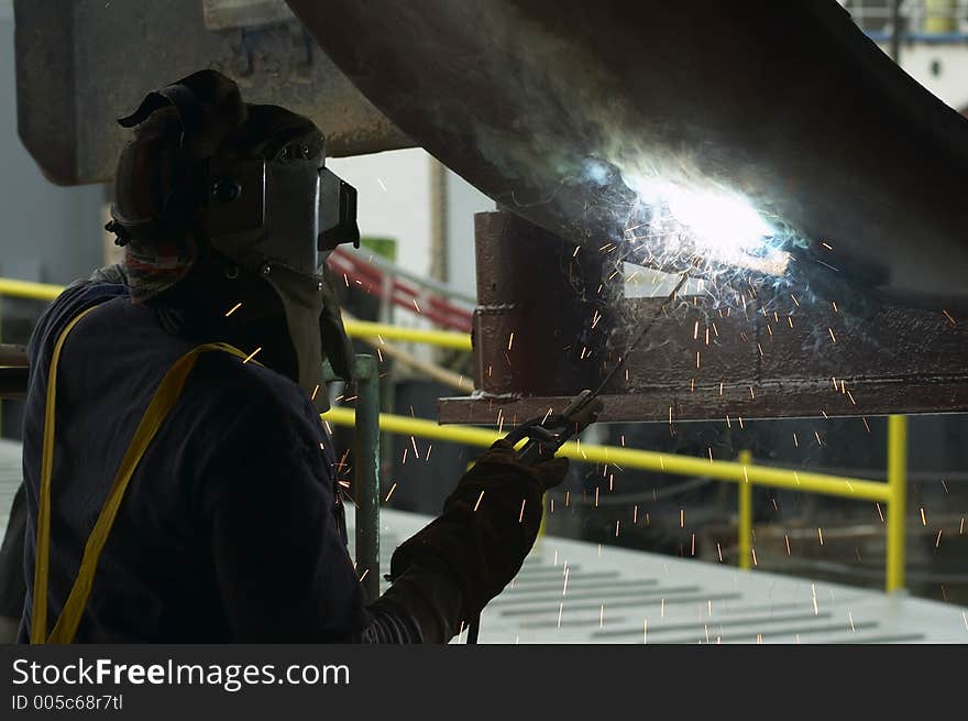 Welder working on ship. Welder working on ship