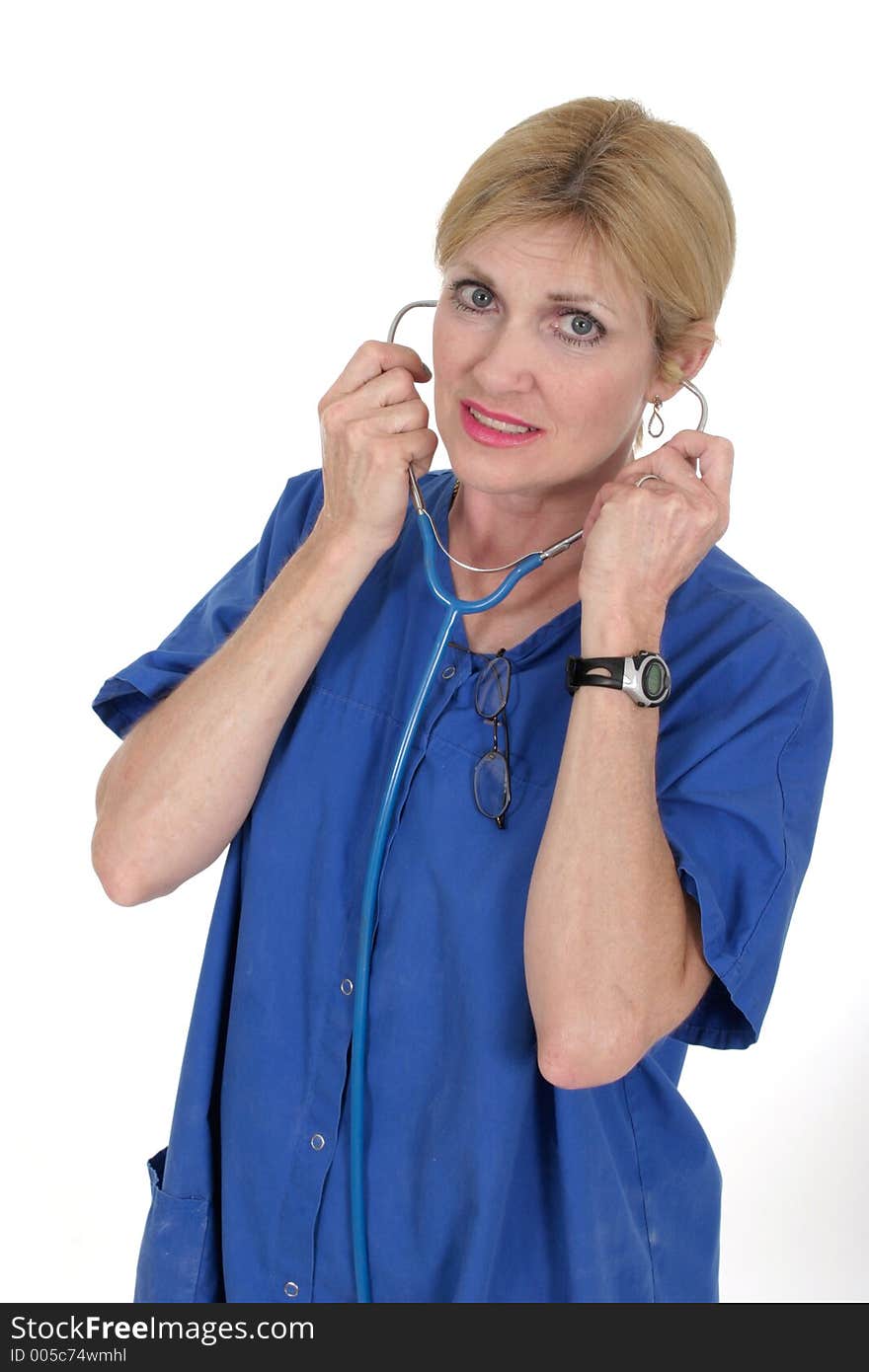 Headshot photo of beautiful nurse or doctor putting on stethoscope. Headshot photo of beautiful nurse or doctor putting on stethoscope