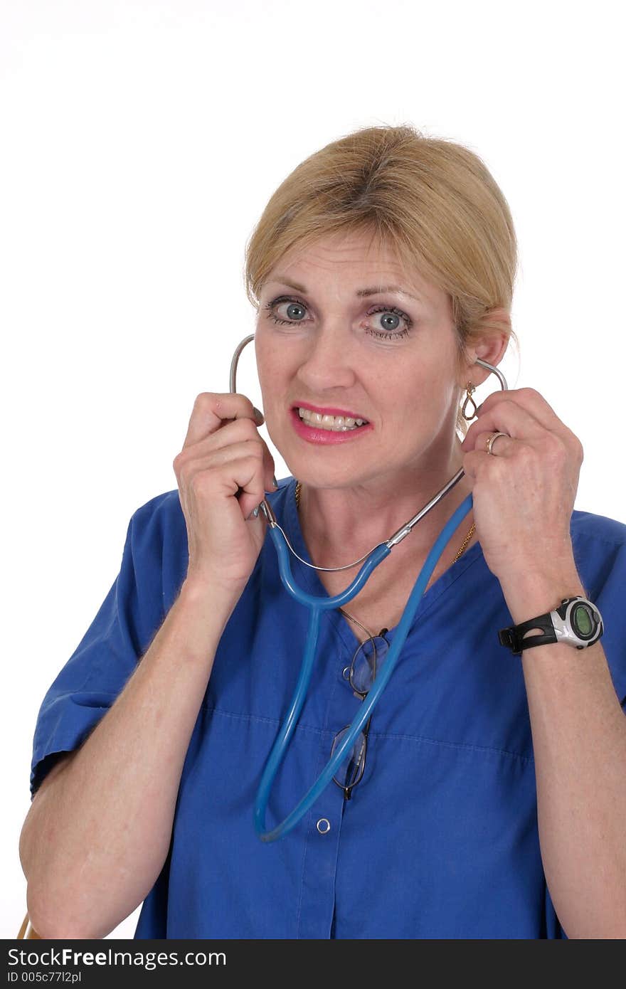 Headshot photo of beautiful nurse or doctor putting on stethoscope. Headshot photo of beautiful nurse or doctor putting on stethoscope