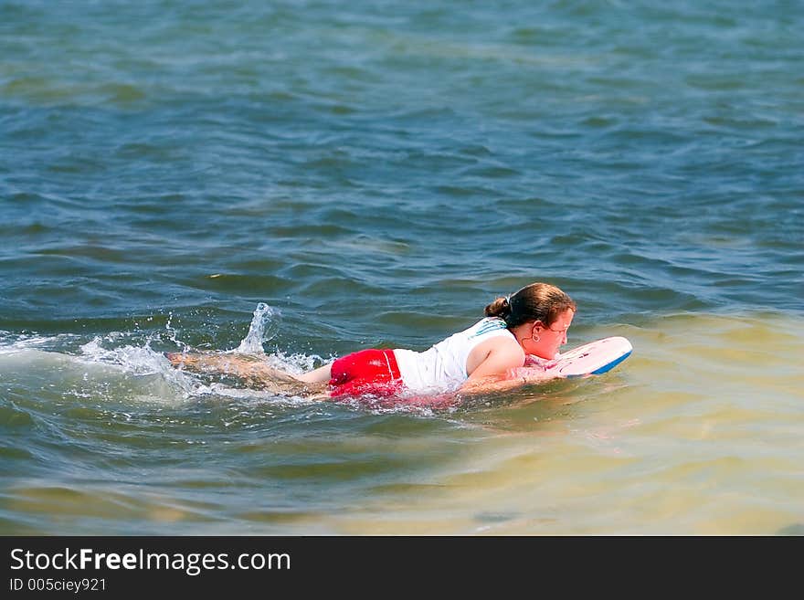 Girl on body boarding swimming. Girl on body boarding swimming