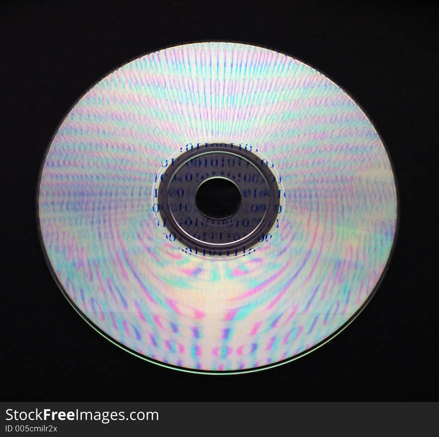 A CD on black background reflecting ones and zeros. Contain embedded clipping path. A CD on black background reflecting ones and zeros. Contain embedded clipping path.