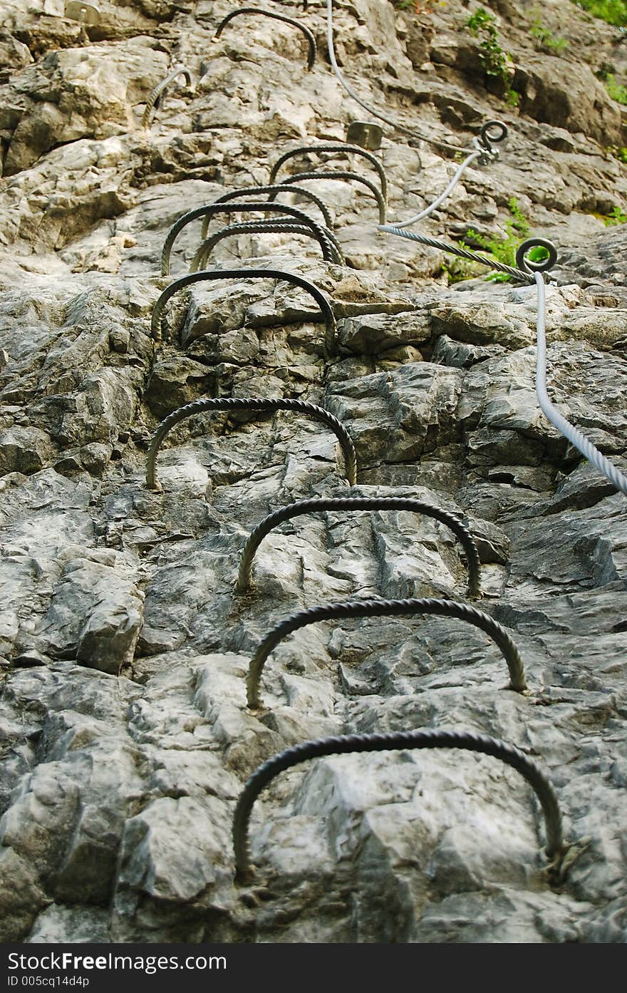 Metal steps on a mountain, for rock climbers. Metal steps on a mountain, for rock climbers.