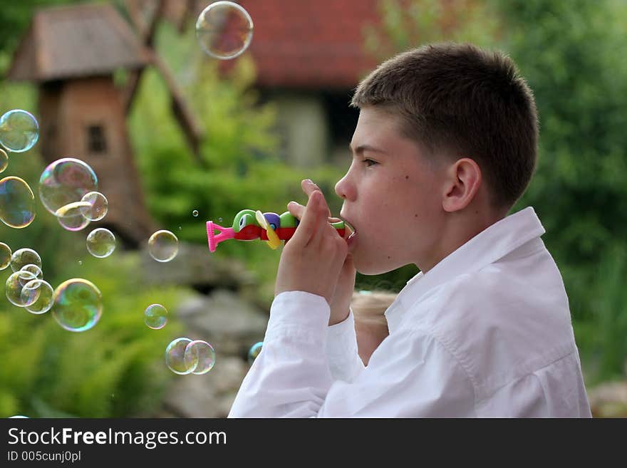 Boy blow soap-bubble