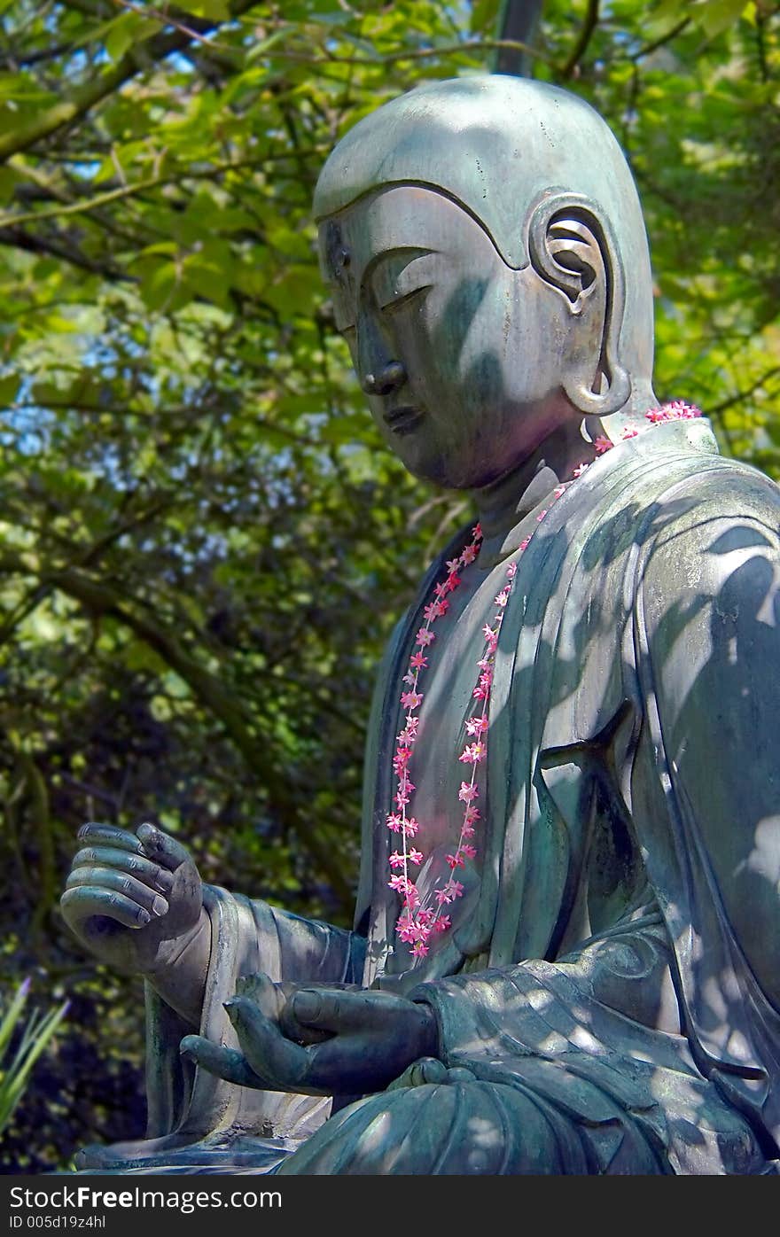 A buddah with flowers