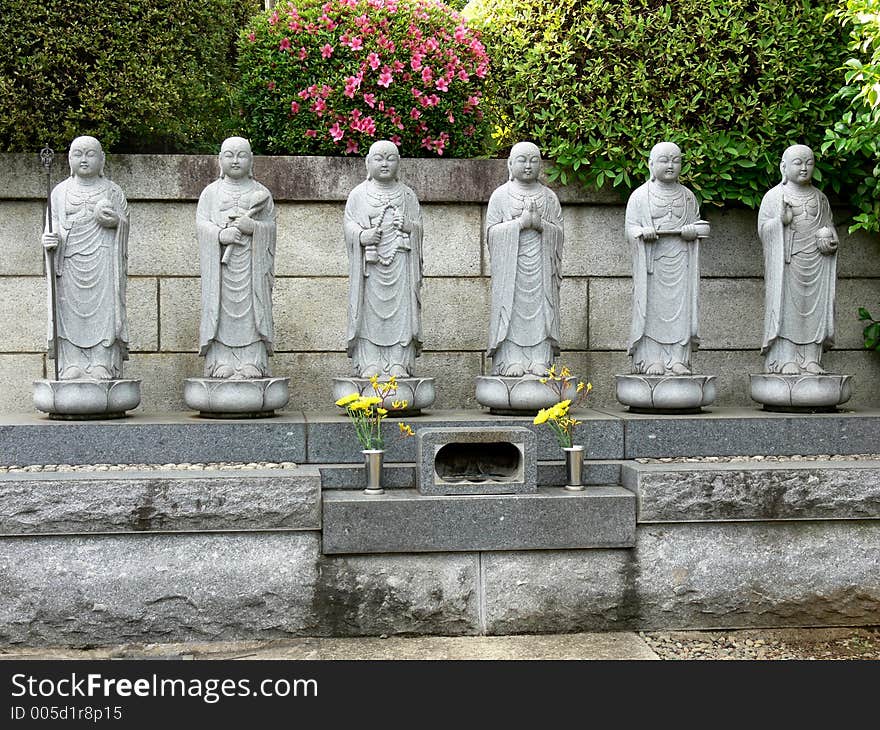 Six stone buddhas on a little altar