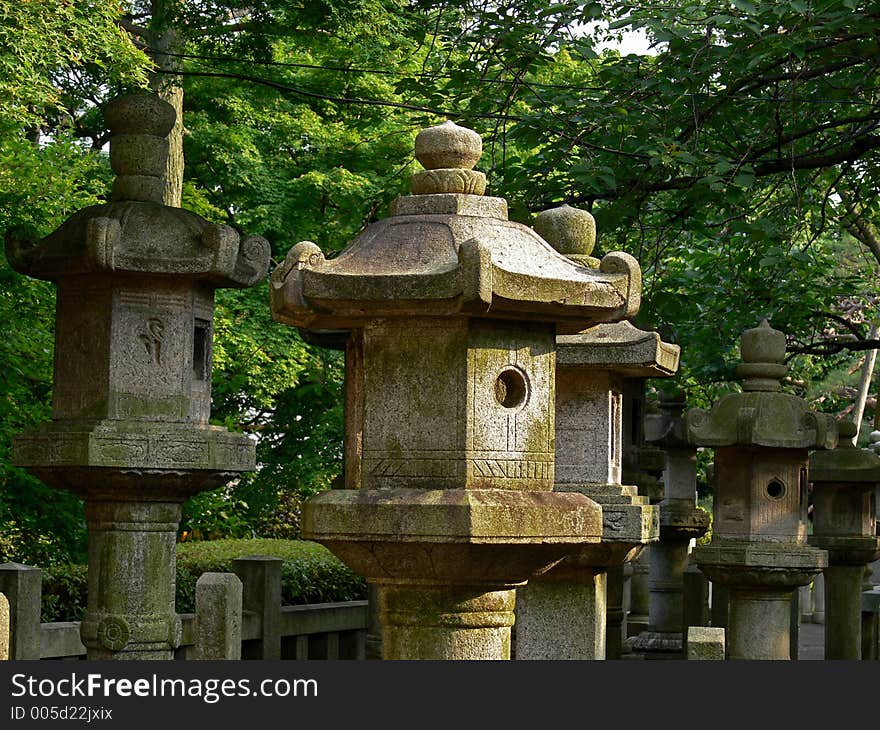 Stone lanterns on a graveyard in Tokyo