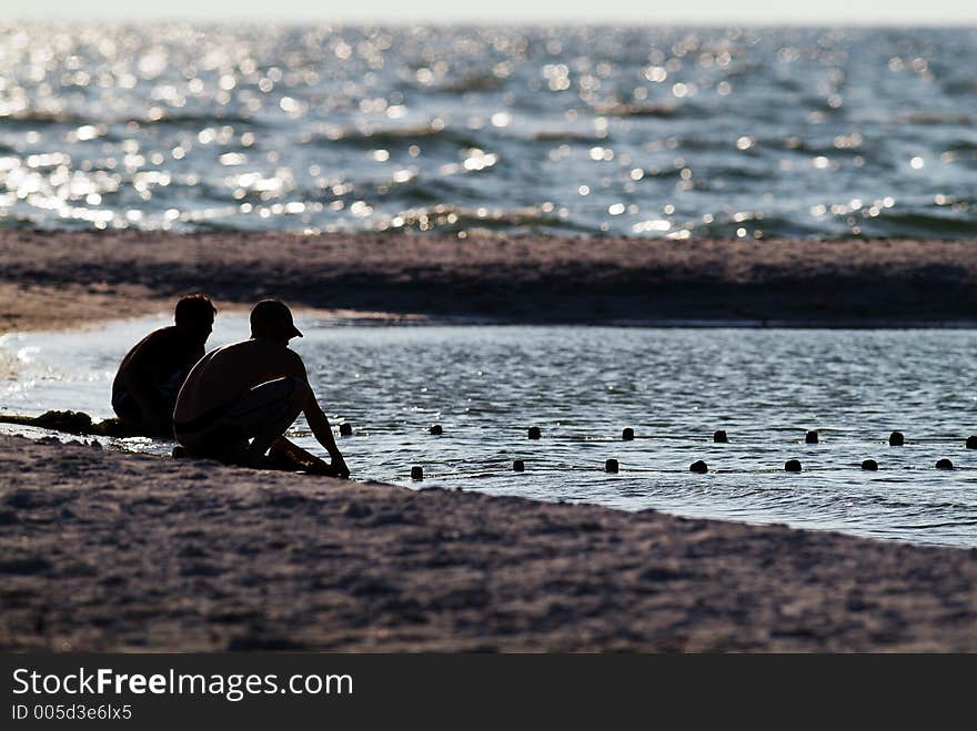 Two boys baitfishing at the gulf.