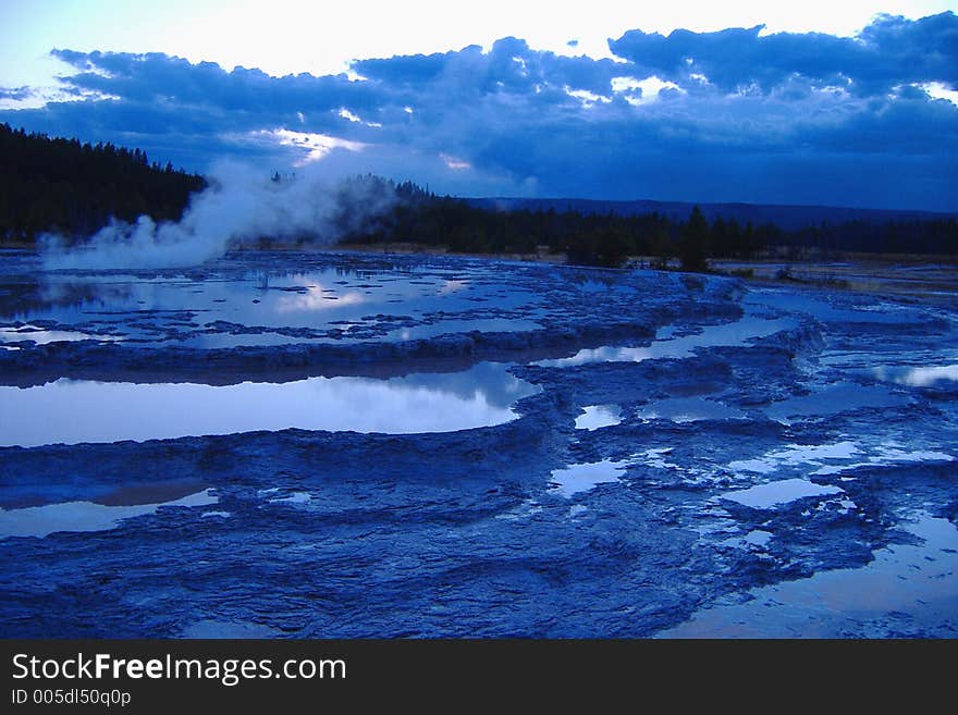 Great Fountain Geyser in Yellowstone National Park at Sunset (in a beautiful blue hue)