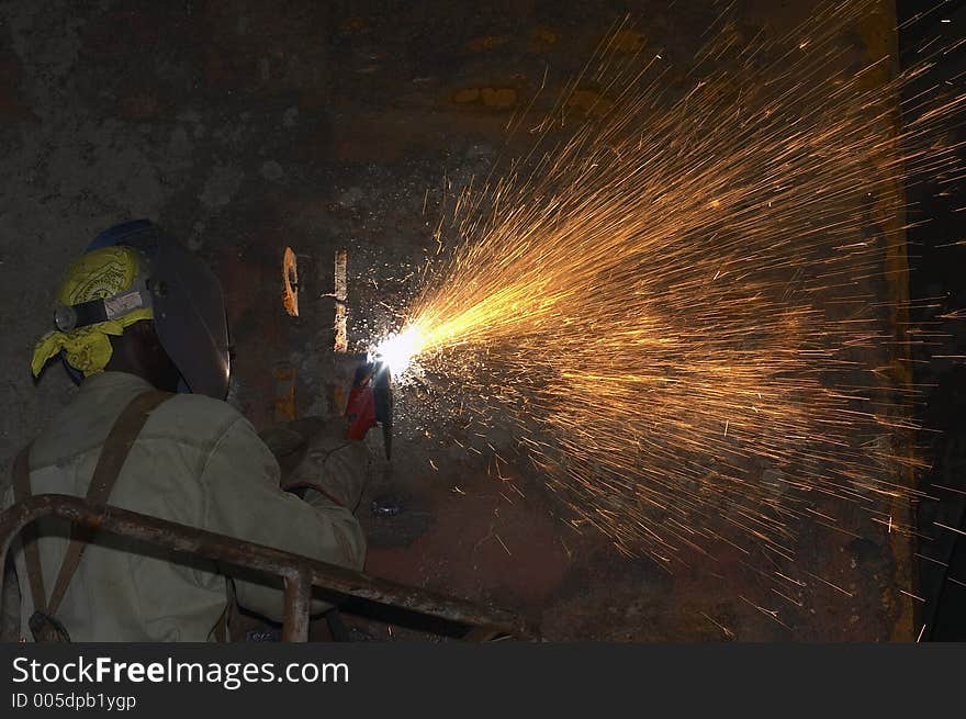 Arc welder working out of manlift. Arc welder working out of manlift