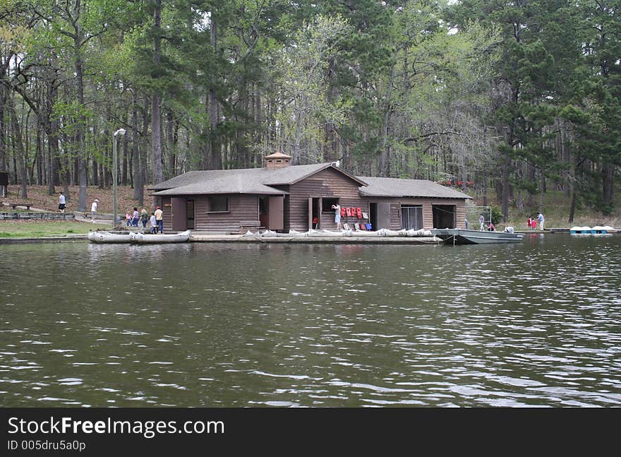 Commercial boat house by the lake with people